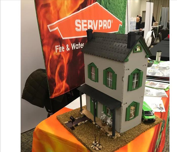 Small House Display on a table at a Trade Show with the SERVPRO Logo